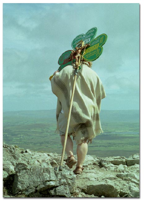 Pilgrim dressed as St. PAtrick climbing Croagh Patrick, Co. Mayo